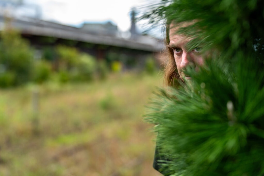 Evan Hiding in the bushes